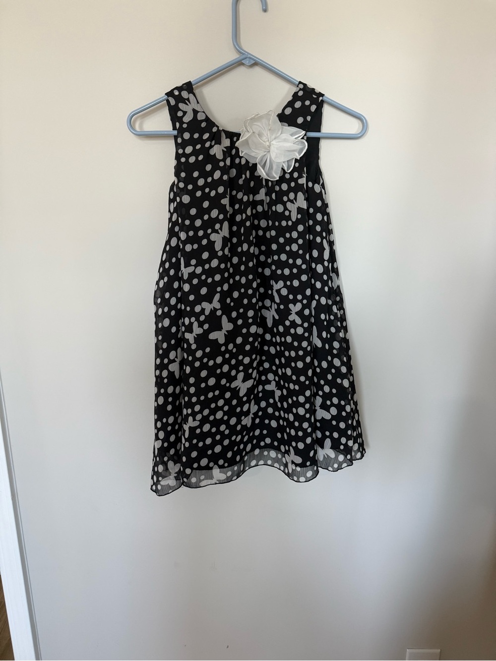 Pippa & Julie Black and White Polka Dot Butterfly Dress with Flower Accent